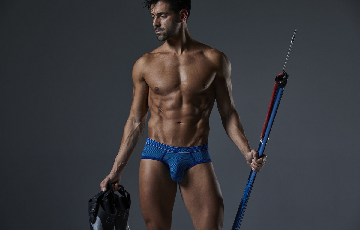 Lifestyle editorial image featuring Cocksox CX76PRO Pro Collection men's underwear sports briefs in Diver